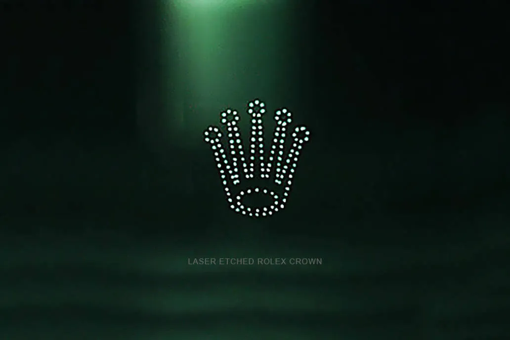 Laser-etched crown at 6 o’clock on replica Rolex sapphire crystal 2025